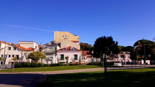 Houses against clear blue sky