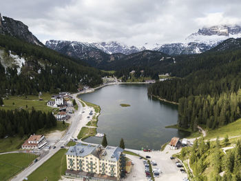 High angle view of snowcapped mountains and lake against sky