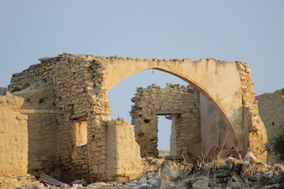 Old ruin building against clear sky