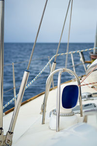 Sailboat sailing in sea against sky