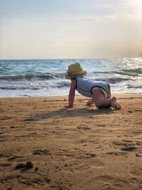 Full length of man on beach against sky