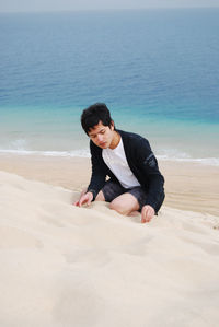 Full length portrait of man on beach