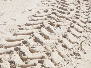 Full frame shot of tyre tracks in sand