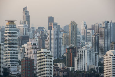 Modern buildings in city against sky