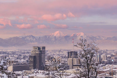 Cityscape against sky during winter