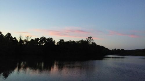 Scenic view of lake at sunset