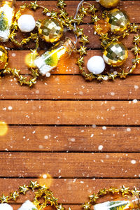 Close-up of christmas decorations on wooden table