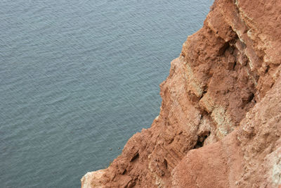 High angle view of rock formation in sea