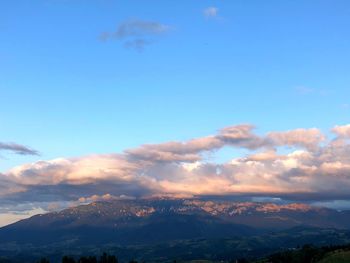 Low angle view of mountains against sky during sunset