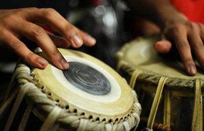 Cropped hands playing tabla