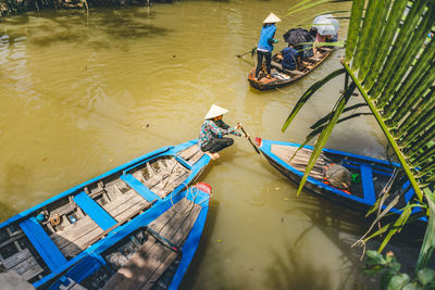 High angle view of people on boat in river