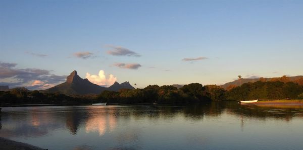 Scenic view of lake against sky during sunset