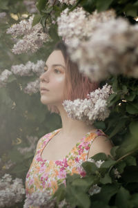 Portrait of young woman looking down