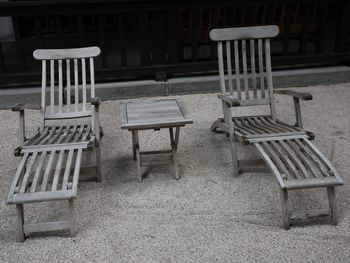 High angle view of empty chairs and table