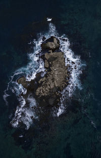 High angle view of water flowing through rocks