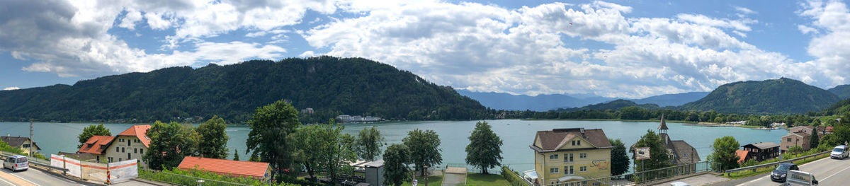 Panoramic view of buildings and mountains against sky