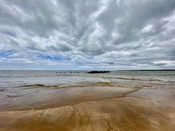 Scenic view of beach against sky