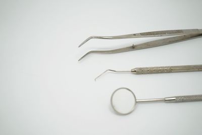 Close-up of dental equipment on white background