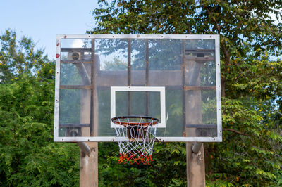 View of basketball hoop against trees