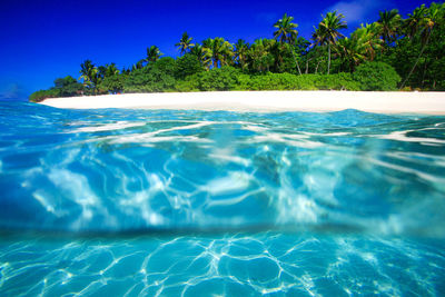 Scenic view of swimming pool against blue sky