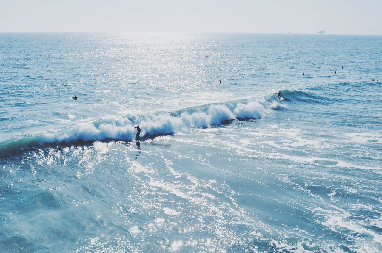 sea, water, wave, leisure activity, horizon over water, lifestyles, beach, vacations, surf, men, nature, beauty in nature, waterfront, scenics, surfing, unrecognizable person, motion, shore