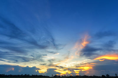 Low angle view of dramatic sky during sunset