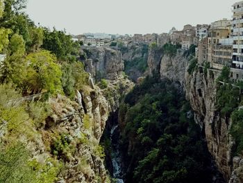 Scenic view of cliff against clear sky