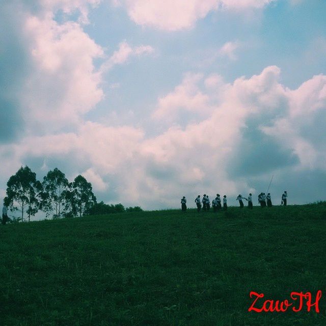 sky, landscape, grass, field, cloud - sky, nature, tranquility, scenics, tree, tranquil scene, beauty in nature, cloudy, grassy, mountain, non-urban scene, cloud, livestock, men, outdoors