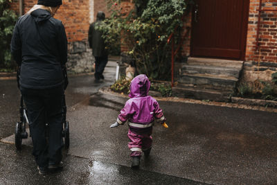 Mother walking with toddler girl