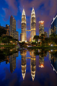 Reflection of buildings in city at night