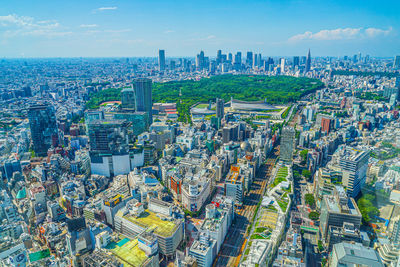 Aerial view of cityscape against sky