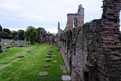 Old ruins of building against sky