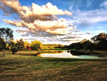 Scenic view of lake against sky during sunset