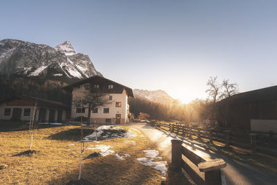 View of houses against mountain and sky