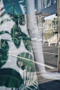 Blurred motion of city street seen through glass window