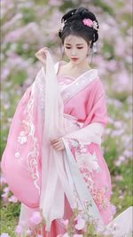 Young asian woman wearing pink hanfu
