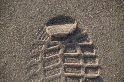 High angle view of ice cream on sand