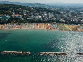 High angle view of townscape by sea