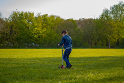 Full length of boy on grassy field