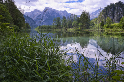 Scenic view of lake and mountains against sky