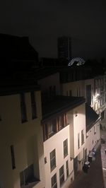 Residential buildings in city at night