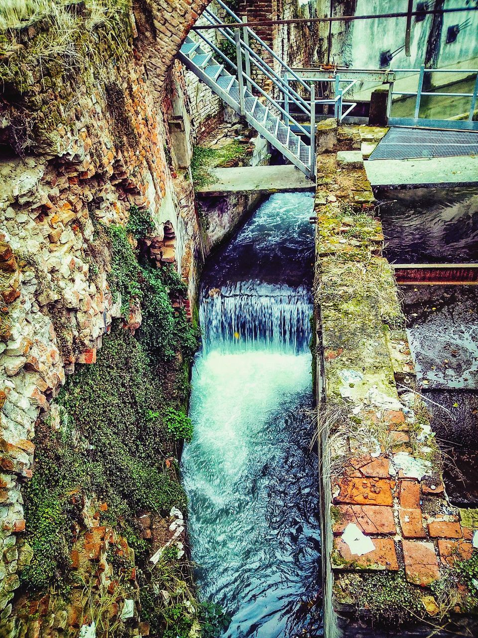 motion, water, flowing water, waterfall, bridge - man made structure, river, long exposure, connection, architecture, hydroelectric power, nature, built structure, outdoors, speed, beauty in nature, day, no people, dam, scenics, travel destinations, rapid, forest, watermill, tree