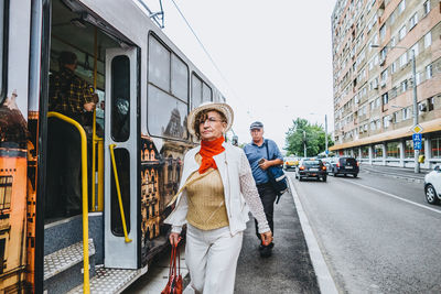 Full length of woman standing in city