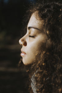 Close-up of young woman with eyes closed