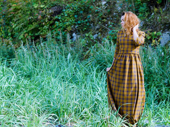 Woman standing on field