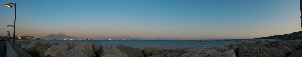 Panoramic view of sea against clear sky