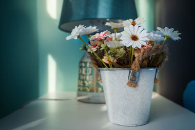 Close-up of white flower vase on table