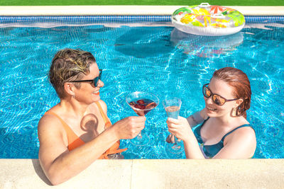 Young woman swimming in pool