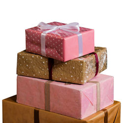 Close-up of pink cupcakes in box against white background