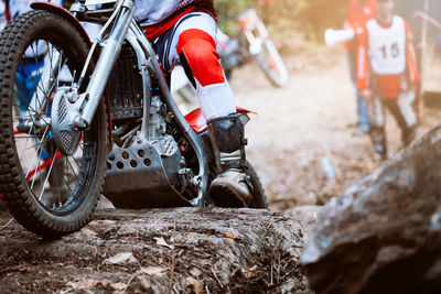 Man racing on bike in forest